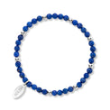 Blue beaded bracelet with silver accents on a white background