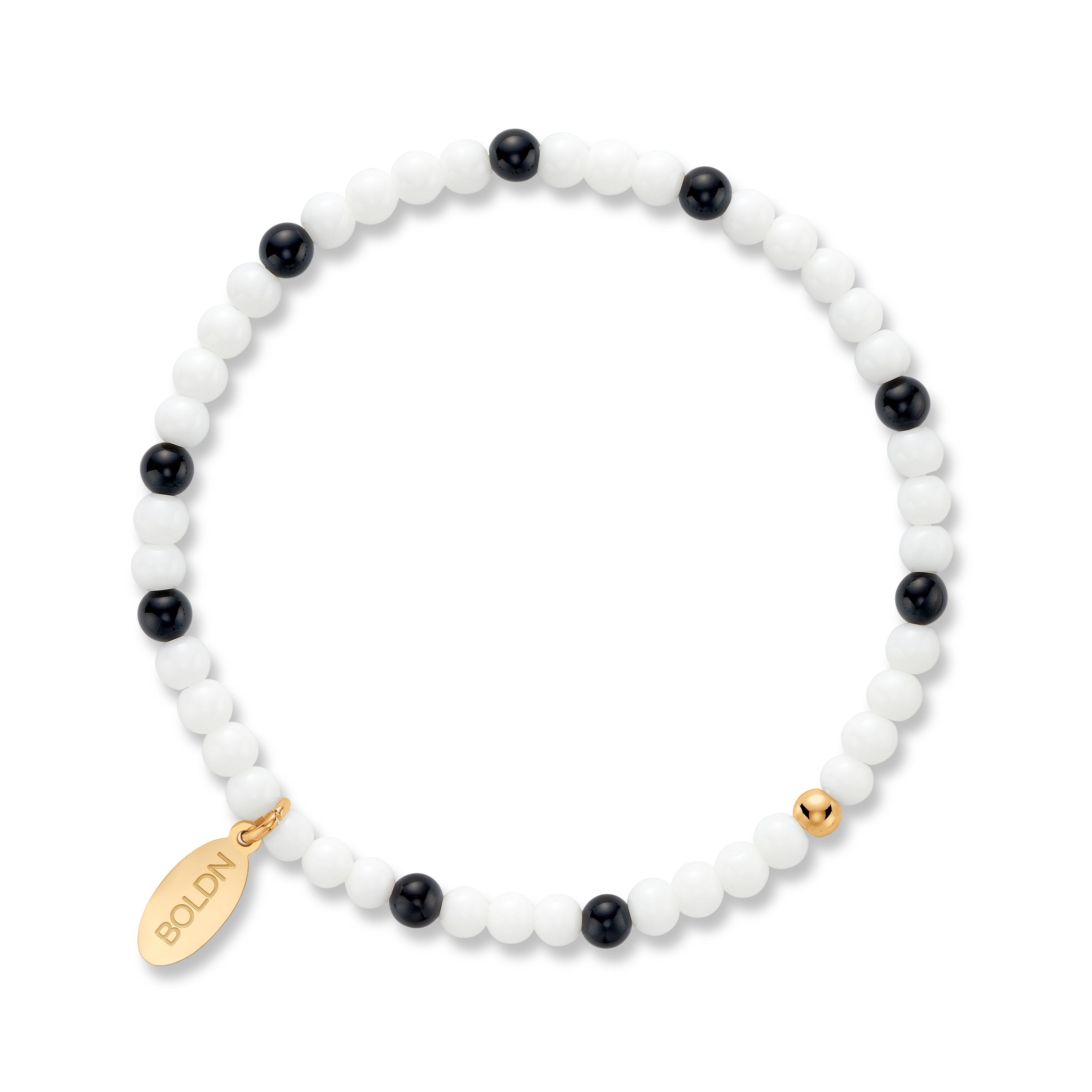 Beaded bracelet with black and white beads and gold accents on a white background